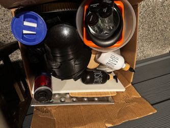 dishes, pots and pans, coffee maker, spice jars, dish soap container, and cookware