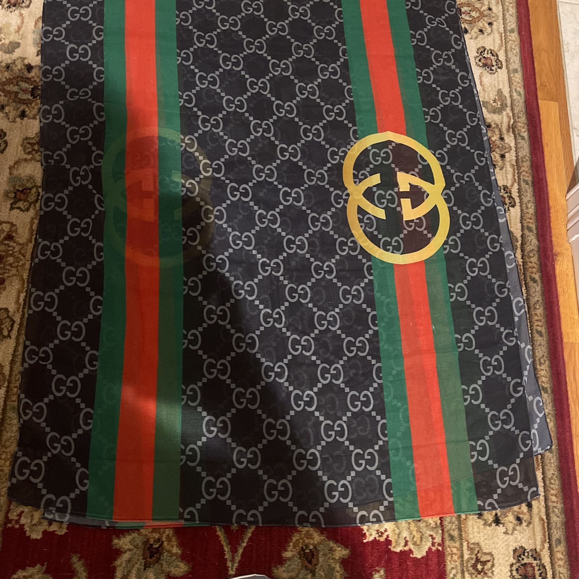 Authentic Gucci black GG print silk scarf 