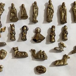 Set of 25 vintage brass religious figurines and nativity animals. Includes saints, Mary, angels, wise men, and various animals — camel, sheep, lion, r
