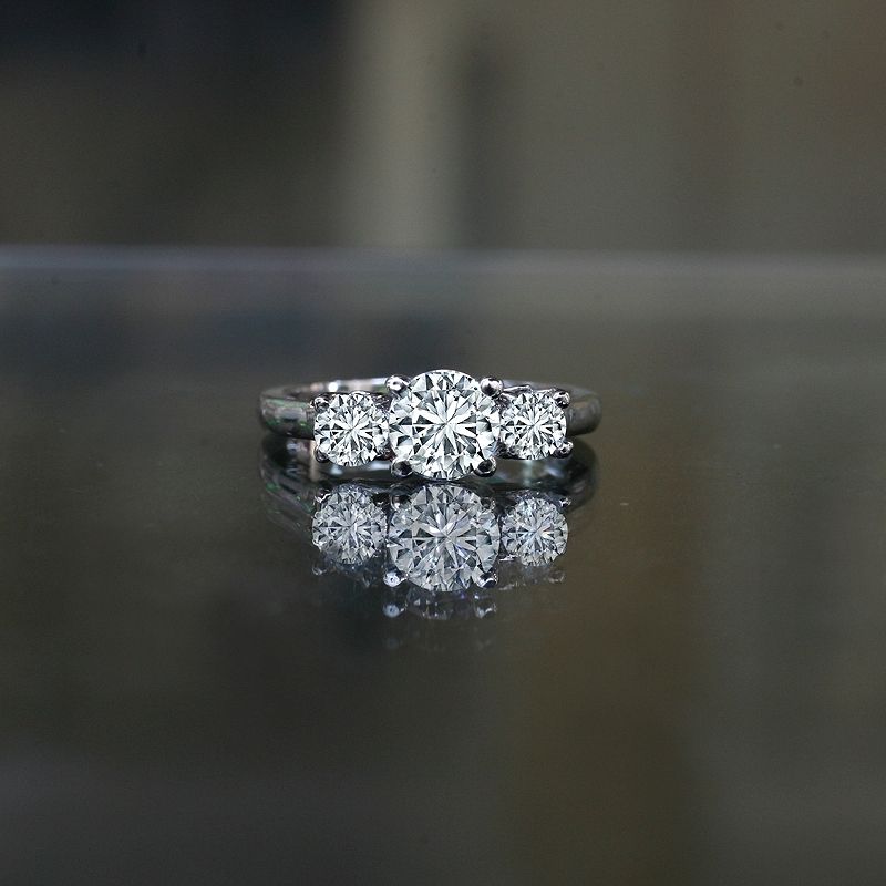 1.50 ct tw (1 ct center), three stone ring diamond simulant-diamond veneer® set in sterling silver platinum electroplated Simulated diamond