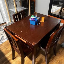 kid’s wooden table with 4 chairs