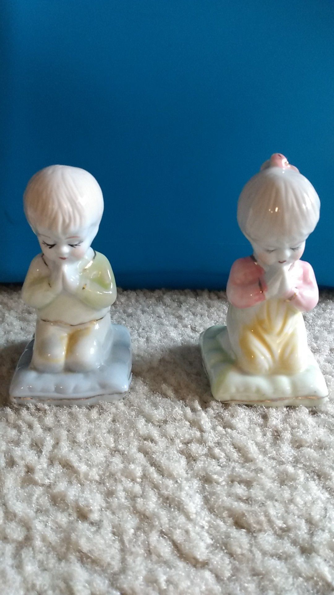 Porcelain praying boy and girl