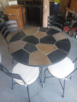 Iron and Stone top table with (4chairs)