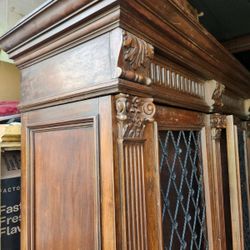 Antique Italian  bookcase hand-carved of walnut 