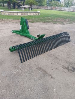Landscape rake implement
