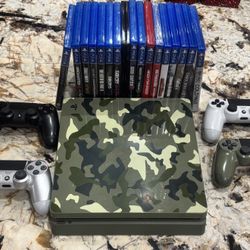 PS4 with 4 controllers, multiple games, and charging dock!