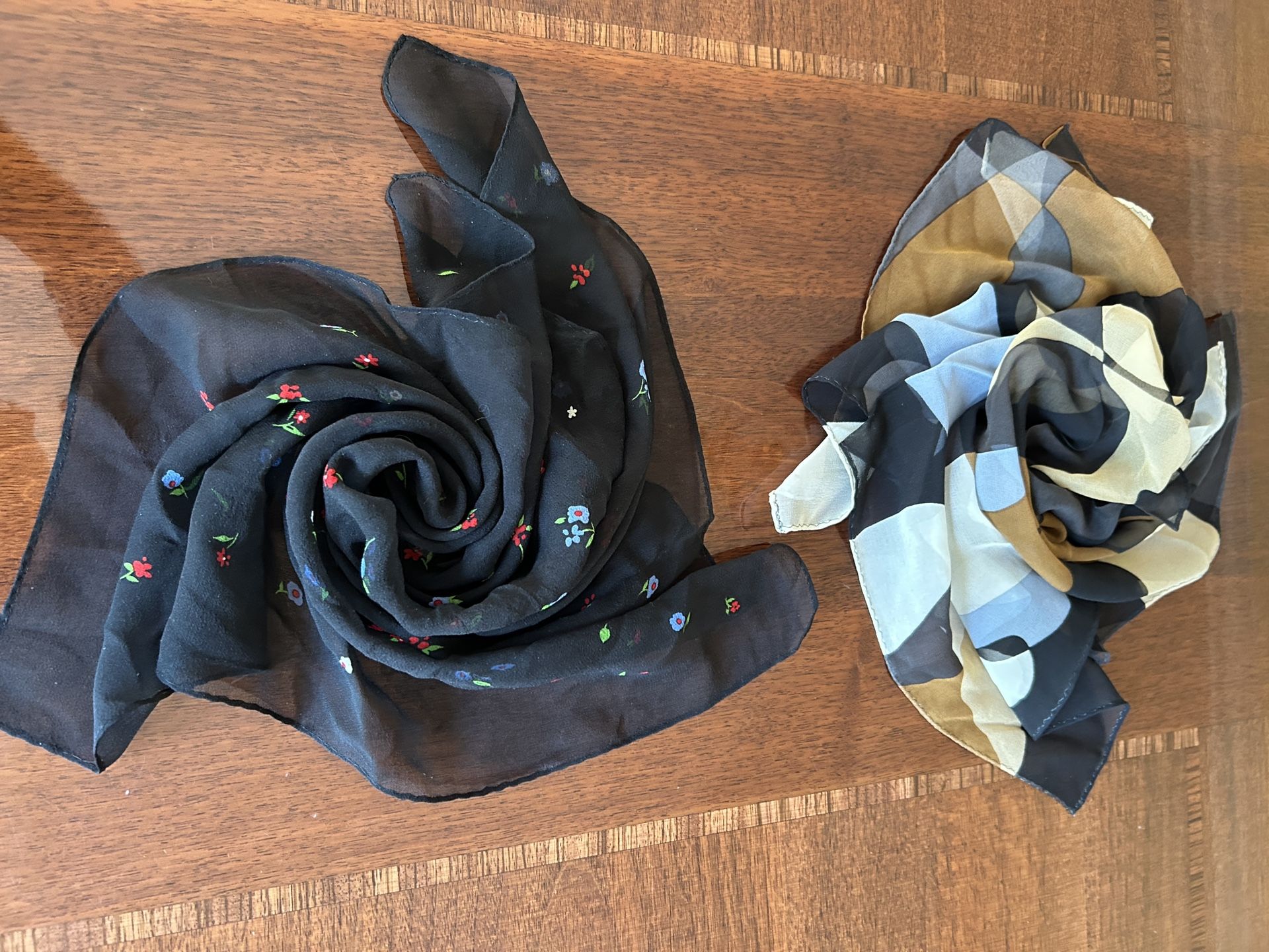 Echo designer Scarf flat one black multicolored flowers, the other multicolored abstract geometric