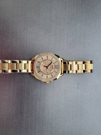 Coach gold and diamond watch paid $495