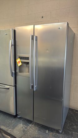Like new LG side by side stainless steel refrigerator