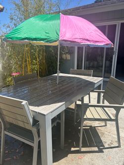Patio table with 4 chairs + umbrella