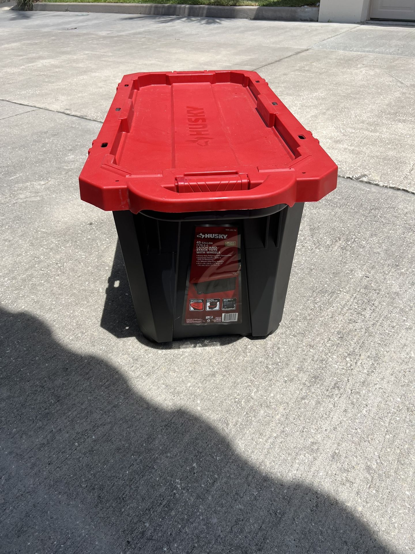 Two Husky 45 Gallon Storage Containers