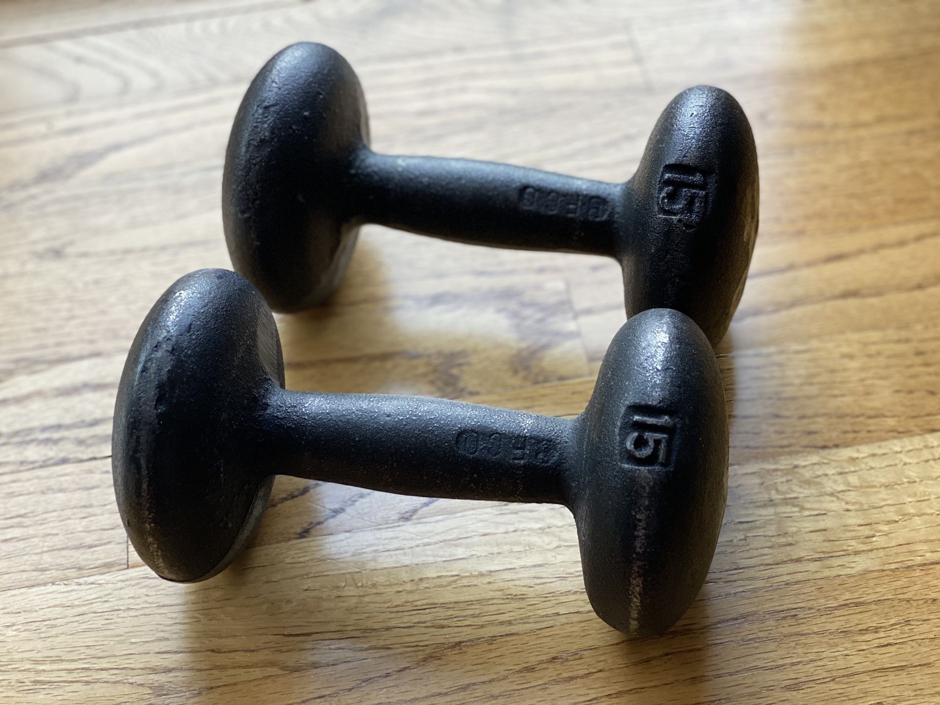 A Pair Of 15lb Cast Iron Dumbbells