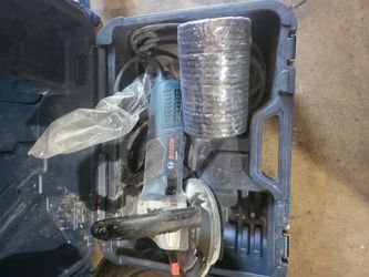 Bosch 5" concrete grinder. Comes with a bunch of extra grinding discs