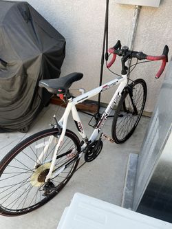 Two Genesis Bikes 1 Vollotti Mountain Bike & 1 Saber 21 Speed