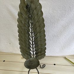 Verdi green iron leaf decorative candle holder.