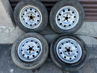 Toyota 14 inch steel wheels with old tires 5 on 100mm