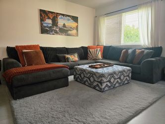 7-Seater Grey Sectional Sofa + Ottoman – $900