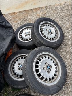 BMW E30 Bottle Cap 14” 4x100 wheels and 195/60/R14 Tire set plus the original BMW Spare tire