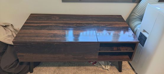 Elevating coffee table