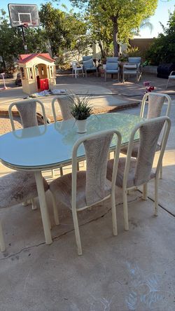 Dining table with 6 chairs and one extension.
