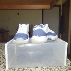 Air Jordan 11 Retro Low in the "Diffused Blue" or "Midnight Navy" colorway. 