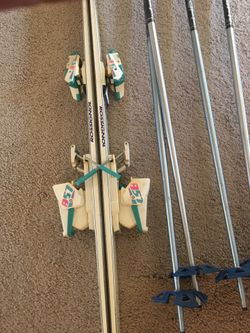 Skis with bindings, poles and boots.