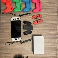 Nintendo Switch, Extra Joycons, Charger/Dock, 4 Mini Controllers, Joycon Grip, 8 Digital Games