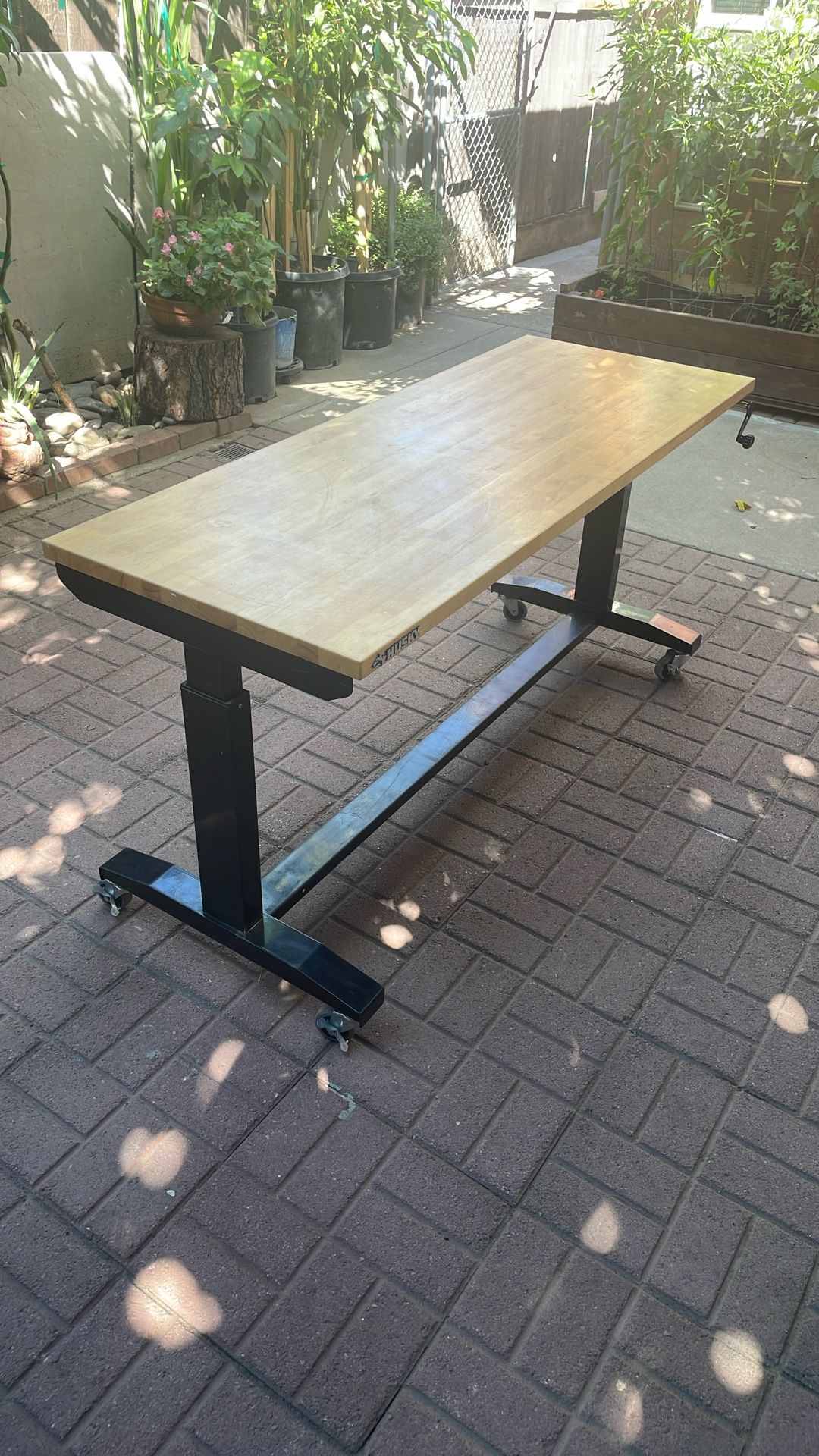 Husky 62 in. W x 24 in. D Adjustable Height Black Workbench Table with Solid Wood Top