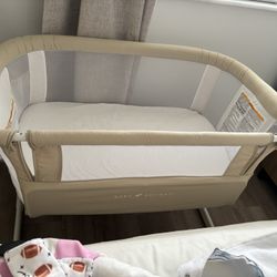 Baby Delight beside me crib