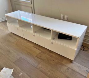 White glossy TV stand with shelves and drawers