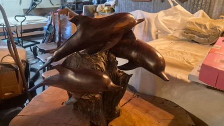 Wooden dolphin statue