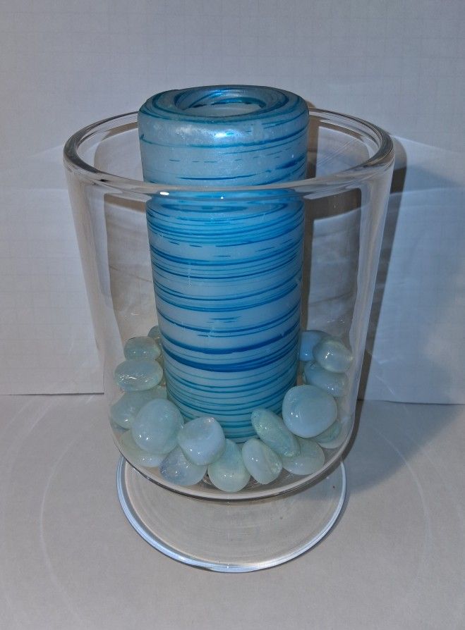 large 9" clear thick glass vase with light blue stones and pillar candle $20 FIRM