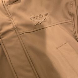 Large Reebok Jacket With Fur On Inside.