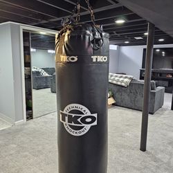 Heavy Duty TKO Total Knockout Punching Bag with I Beam Heavy Duty Steel Bag connector.