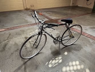 Road Bike Black and Silver Univega, and two cruisers