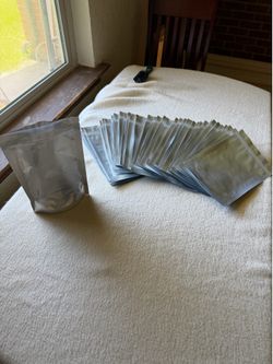 BAGS, 47 silver & clear, 6"w x 9"tall; cross streets are Waterview & Arapaho