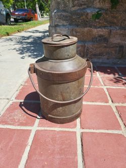 Old Milk Can     10" in diameter ,  body is 12" tall,  with neck and lid it is 17" tall