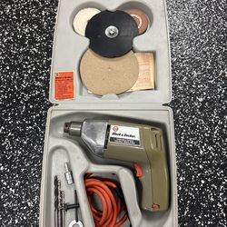 BLACK & DECKER Drill Kit, model number 7025, which includes a variable speed drill, a carrying case, and various accessories.