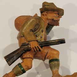 Vintage German Folk Art Black Forrest Carved Wooden Hunter Figurine. 
Pre-owned, very good shape, no chips or cracks. Display item