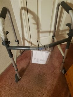 Brand New Adjustable WalkerFolds Up When Not Used Holds Up To 300 lbs Made by INVACARE