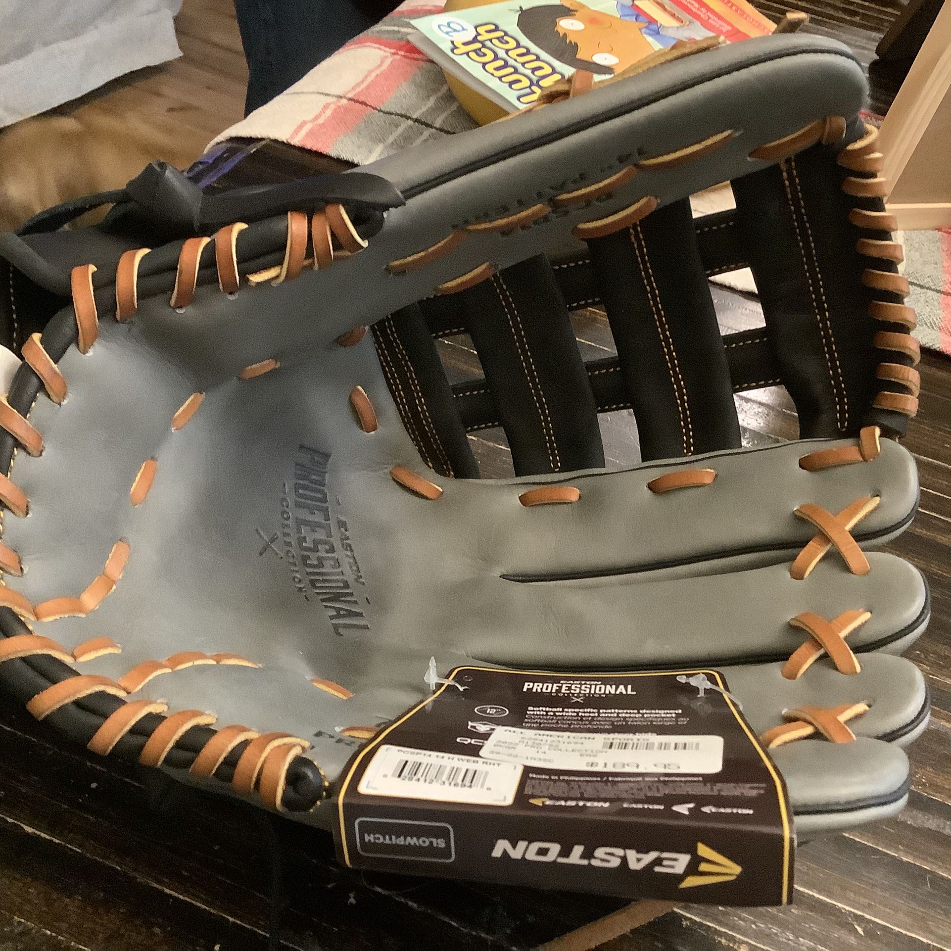 Easton Professional softball glove model 14” glove.  Brand new, rht designed with a wide heel and deep pocket, adjustable wrist for perfect fit. Color