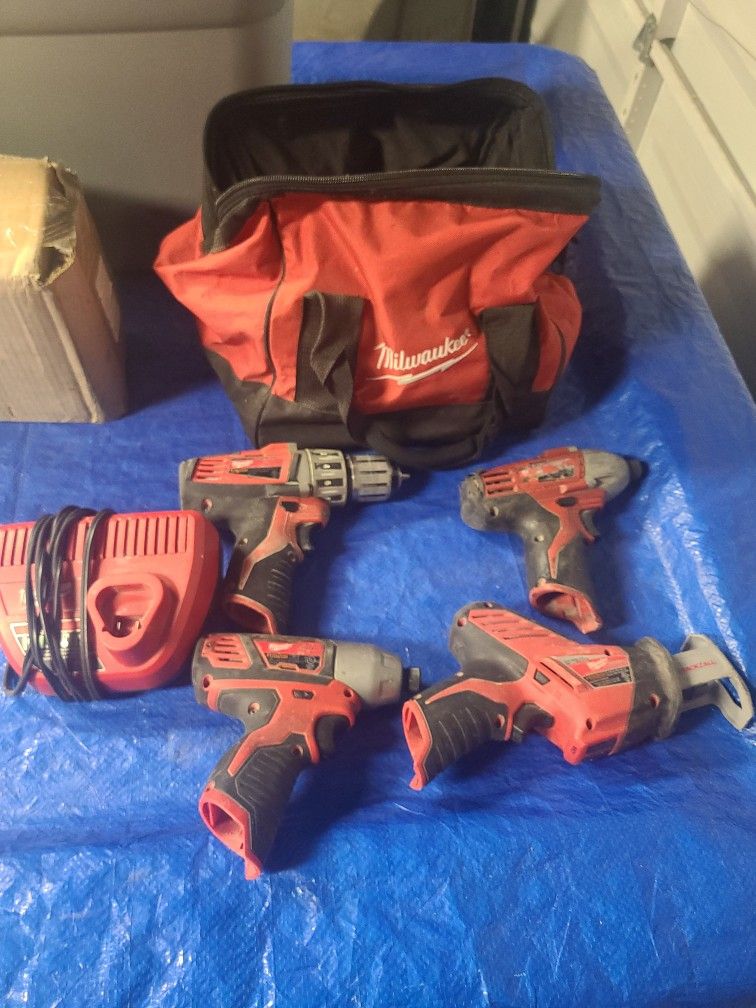 Milwaukee M12 1 Drill 2 Impacts 1 Hackzall 1 Milwaukee Bag 1 Charger No Batteries.all Work