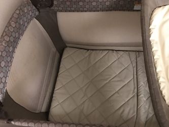 Pack n Play with newborn sleeper