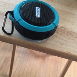 Blue and black  bluetooth speaker