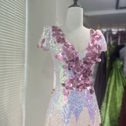 Evening gowns, runway outfits, party dresses—I only wore them once for a runway show. The same wasn't available in the US; it was ordered from oversea