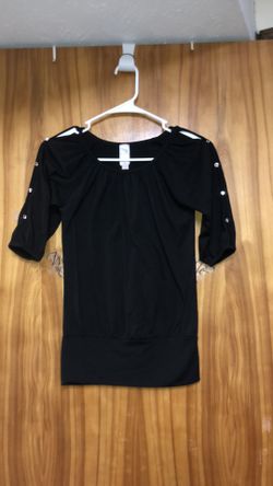 Kid’s size 10 black shirt that has cutouts down the sleeves with diamond like rhinestones