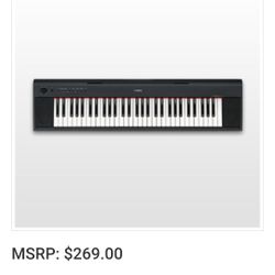 Yamaha Piaggero NP-11 61-Key Portable Keyboard With Power Adapter Black