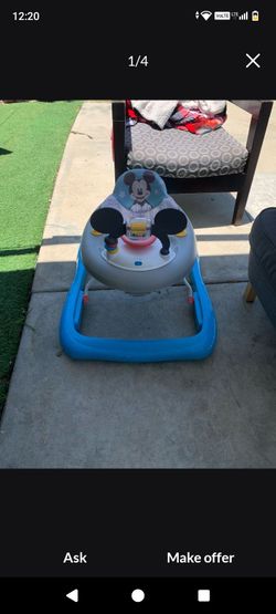 Mickey Mouse Walker  in good condition; battery-operated.