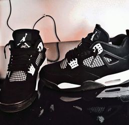 black and white jordan 4s