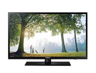 Samsung 65 “ inch television with remote.
